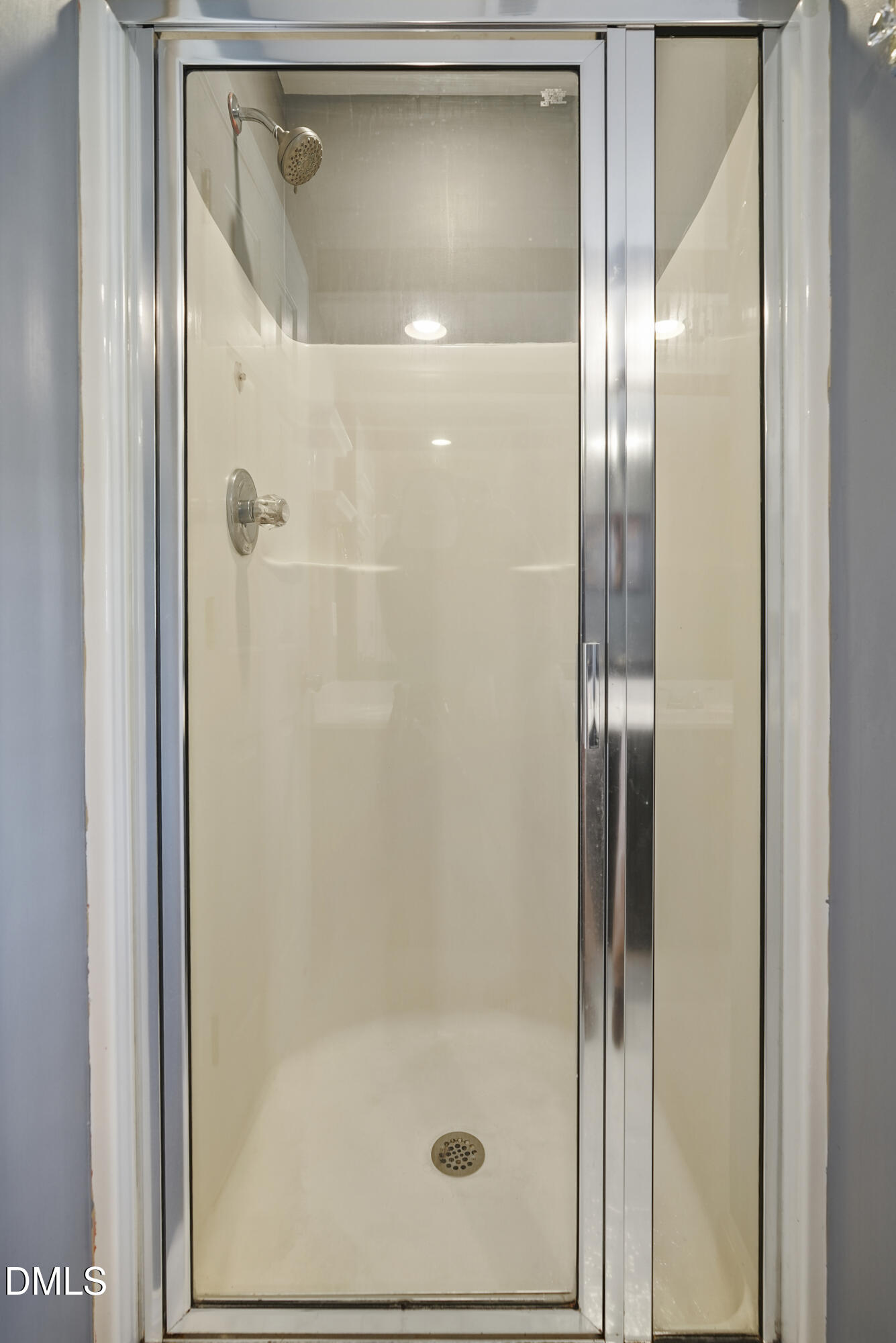 4912 Morning Edge Drive Raleigh, NC 27613 - Photo 29 of 35 a bathroom with a glass shower door