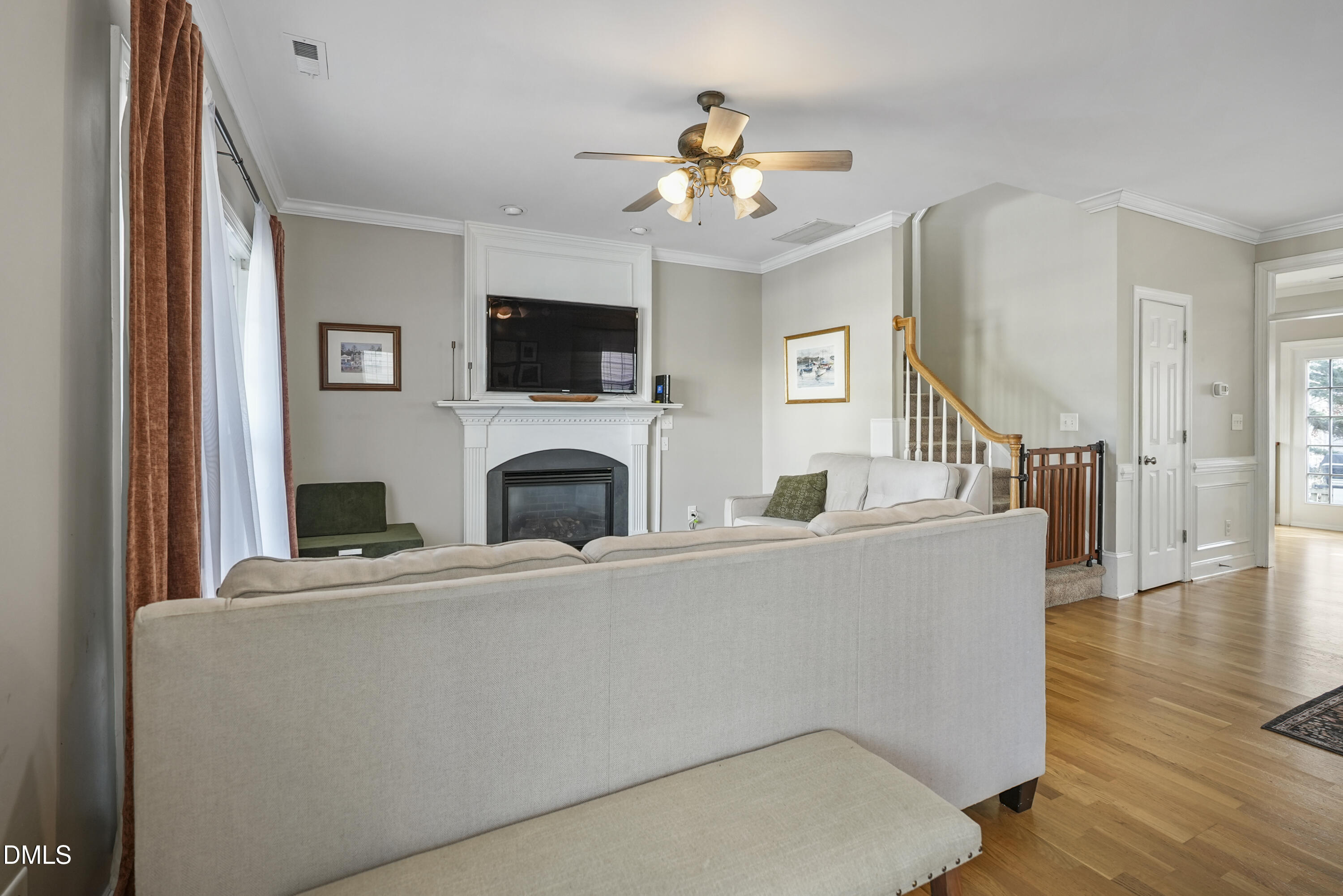 4912 Morning Edge Drive Raleigh, NC 27613 - Photo 4 of 35 a living room with fireplace furniture and a flat screen tv