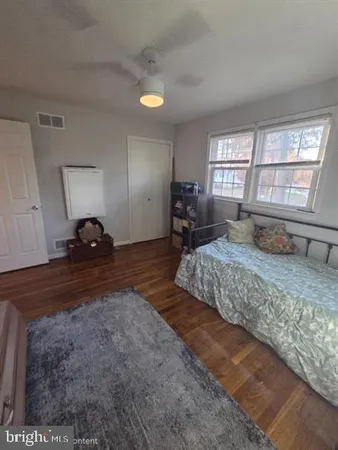 a living room with a couch next to a window