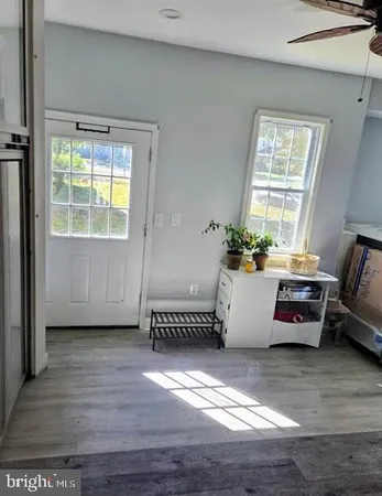 a bedroom with furniture and a window