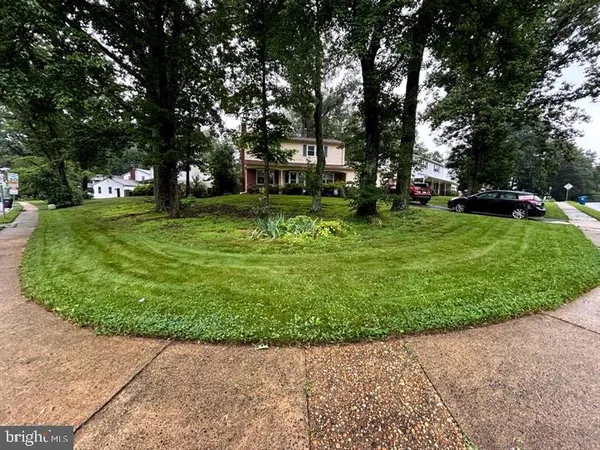 a garden view with a fountain