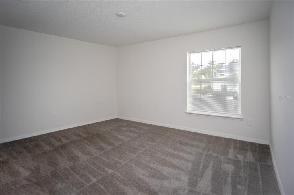 2148 Penny Lane Kissimmee, FL 34741 - Photo 11 of 15 an empty room with windows
