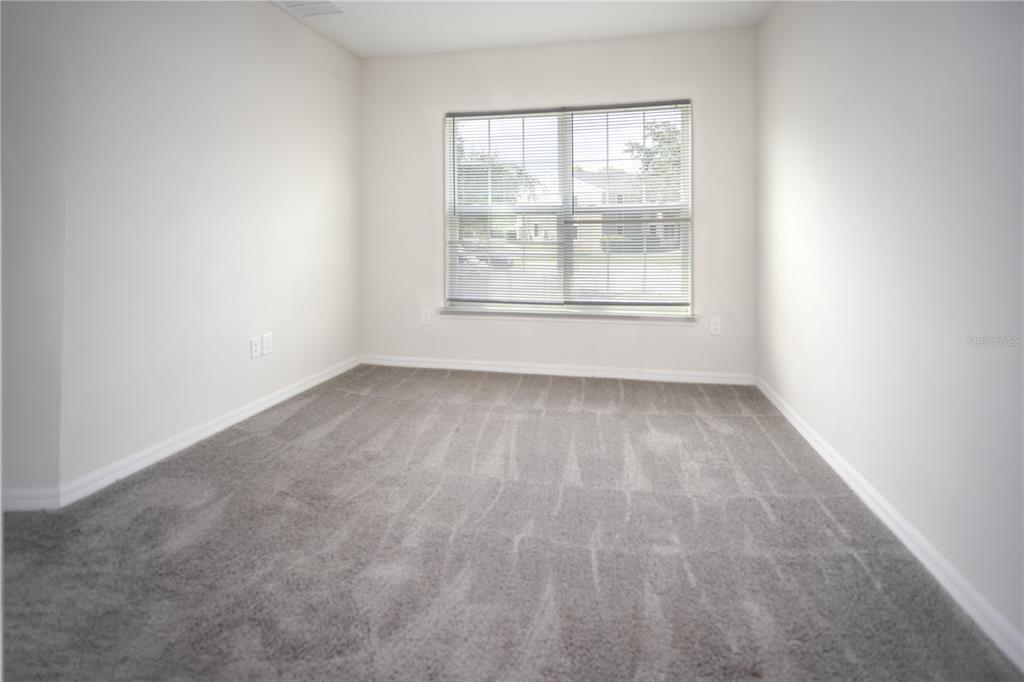 2148 Penny Lane Kissimmee, FL 34741 - Photo 12 of 15 an empty room with a window