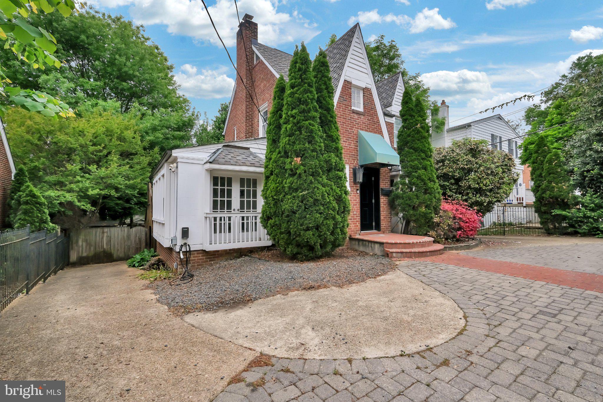 1706 North Glebe Road Arlington, VA 22207 - Photo 34 of 36 Charming brick home with lush greenery.