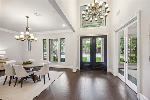 a view of a livingroom with furniture window and wooden floor