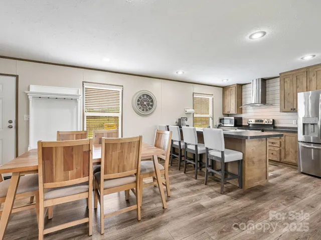 a living room with granite countertop furniture and kitchen view