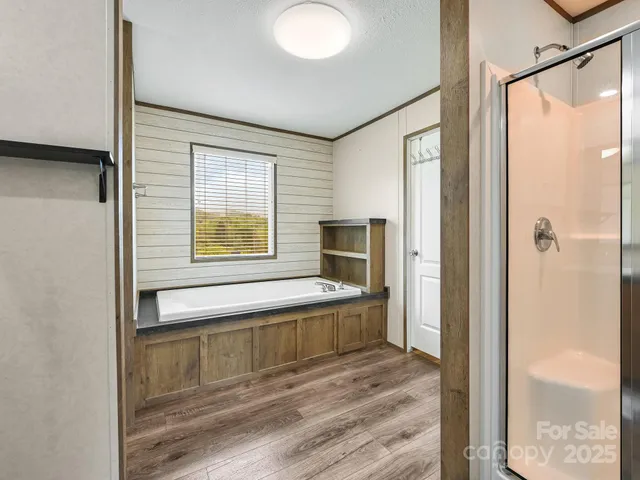 a bathroom with a tub and a sink