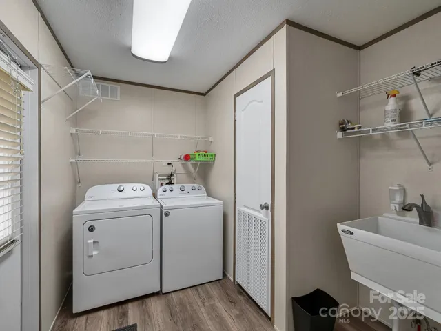a view of bathroom with washer and dryer