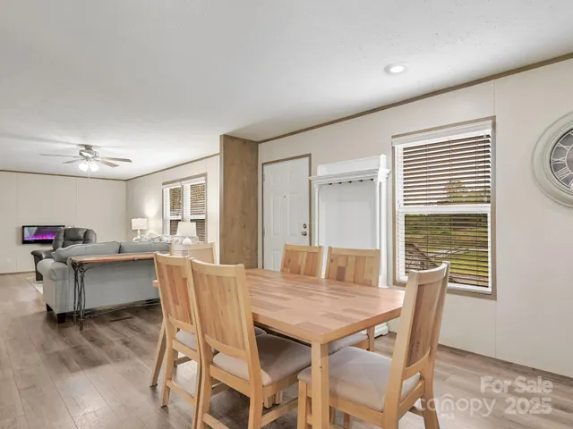 a dining room with furniture and window