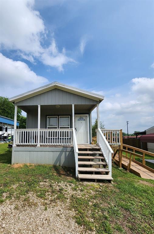 191 Sioux Quitman, TX 75783 - Photo 2 of 23 a front view of a house with a yard
