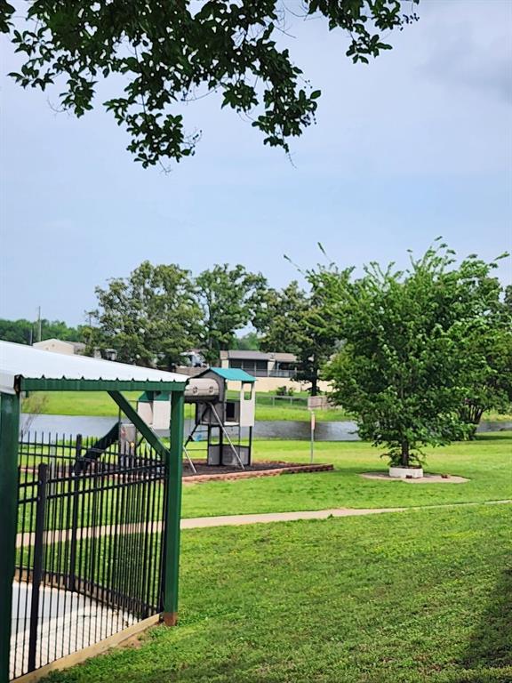 191 Sioux Quitman, TX 75783 - Photo 22 of 23 a view of a swimming pool with a garden