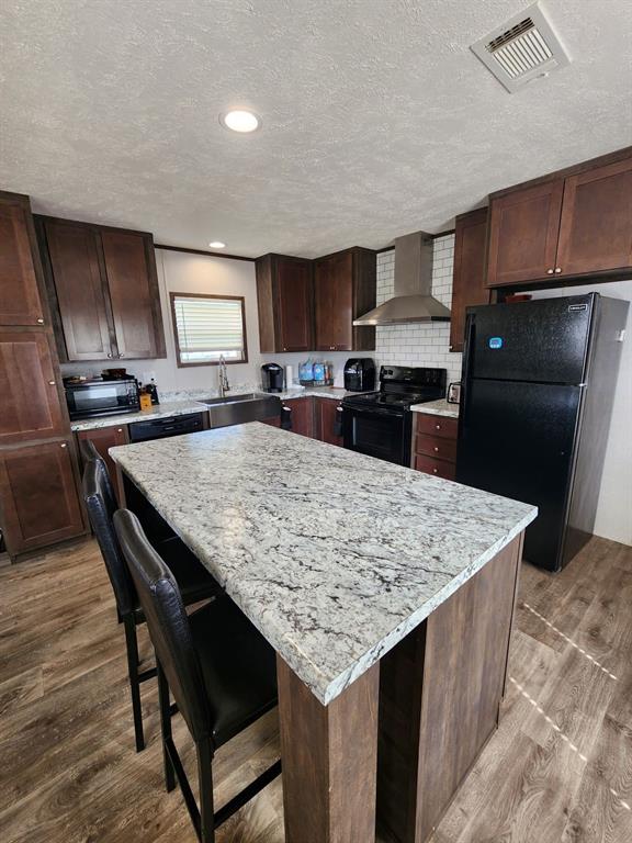 191 Sioux Quitman, TX 75783 - Photo 8 of 23 a kitchen with a stove a refrigerator and a sink