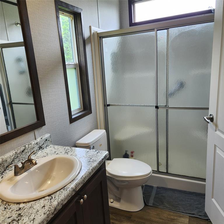 191 Sioux Quitman, TX 75783 - Photo 9 of 23 a bathroom with a sink toilet and shower