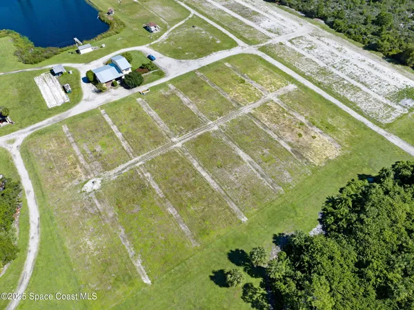 an aerial view of a pool yard swimming pool and outdoor seating