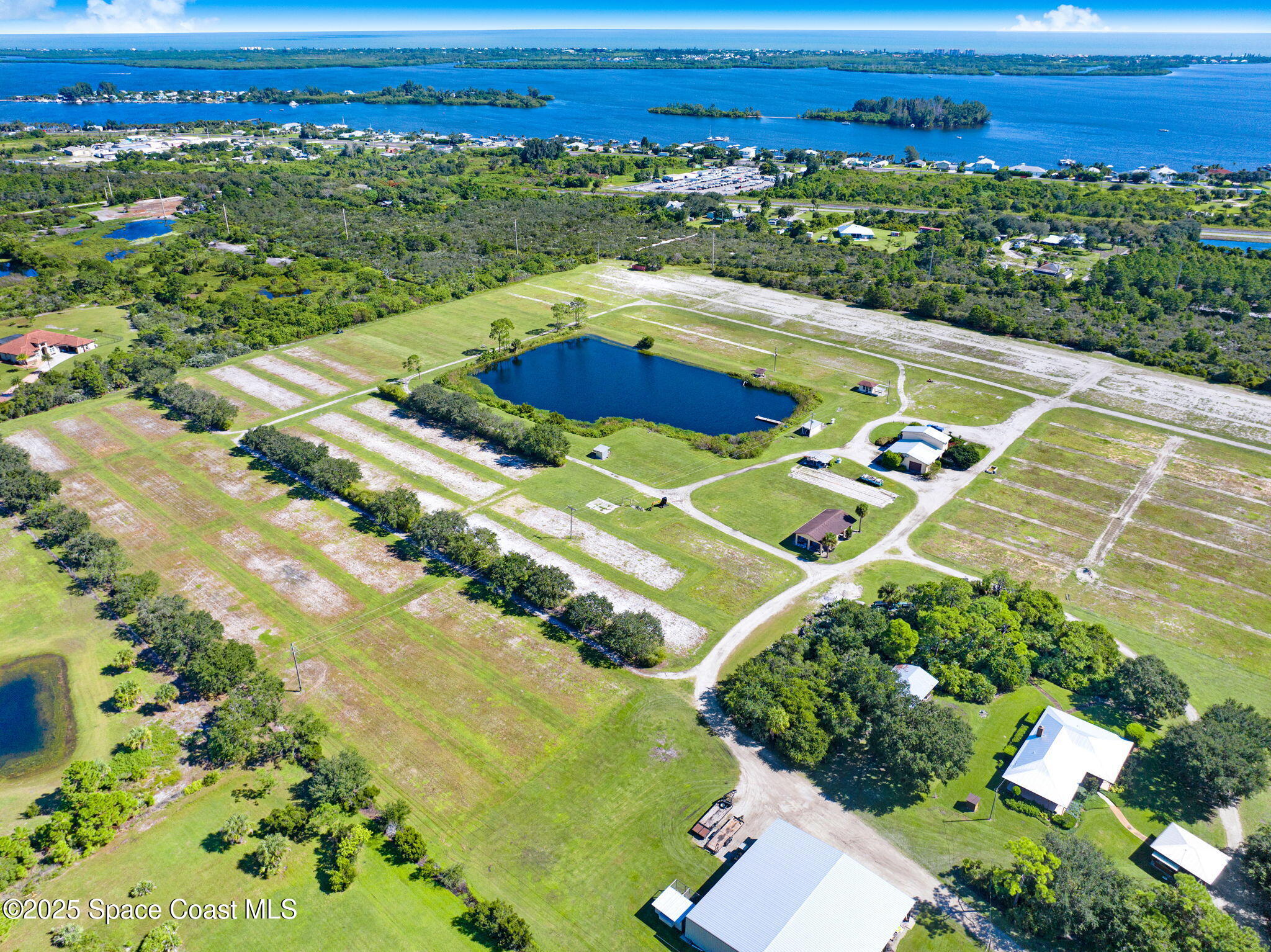 B Berry Road Grant Valkaria, FL 32949 - Photo 6 of 46 a view of a swimming pool with a yard