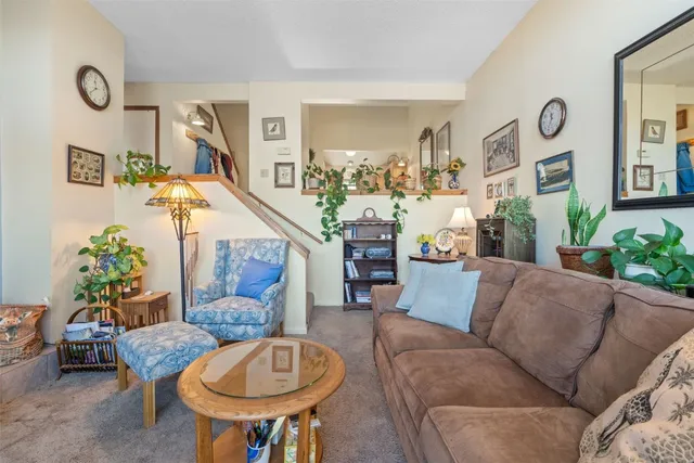 a living room with furniture and a table