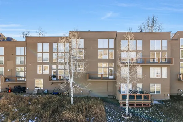 a front view of a building with a yard