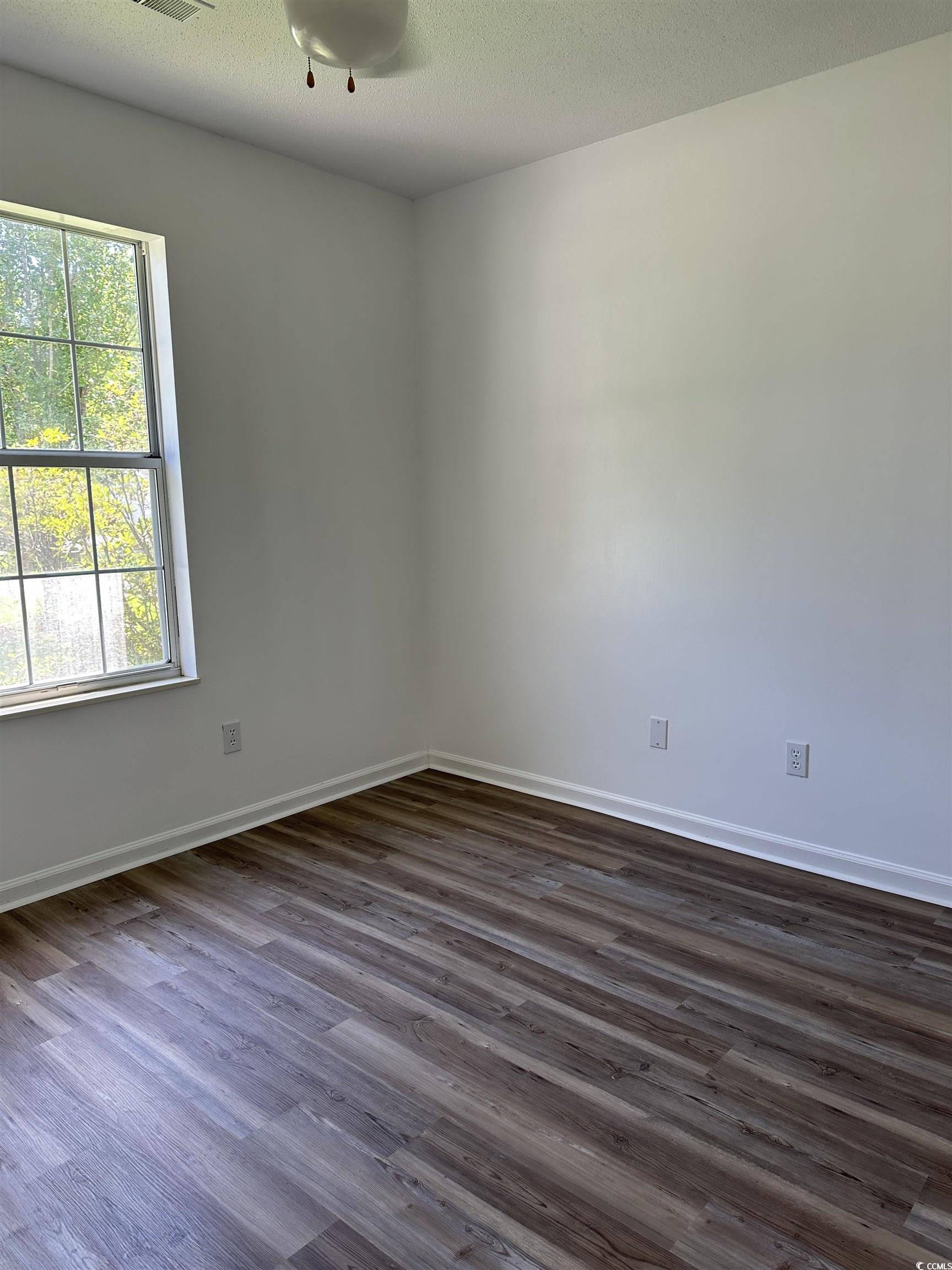 105 Robin Court Murrells Inlet, SC 29576 - Photo 9 of 13 Unfurnished room featuring dark wood-style floors