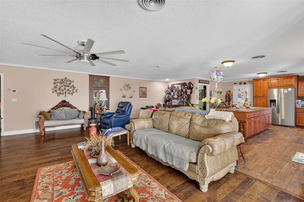 2230 Southwest 87th Place Ocala, FL 34476 - Photo 15 of 42 a living room with furniture and a wooden floor