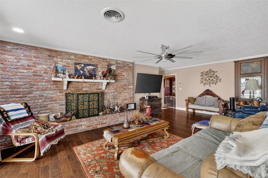 2230 Southwest 87th Place Ocala, FL 34476 - Photo 16 of 42 a living room with furniture and a flat screen tv