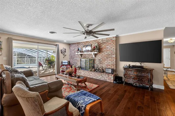 a large kitchen with kitchen island wooden cabinets and stainless steel appliances