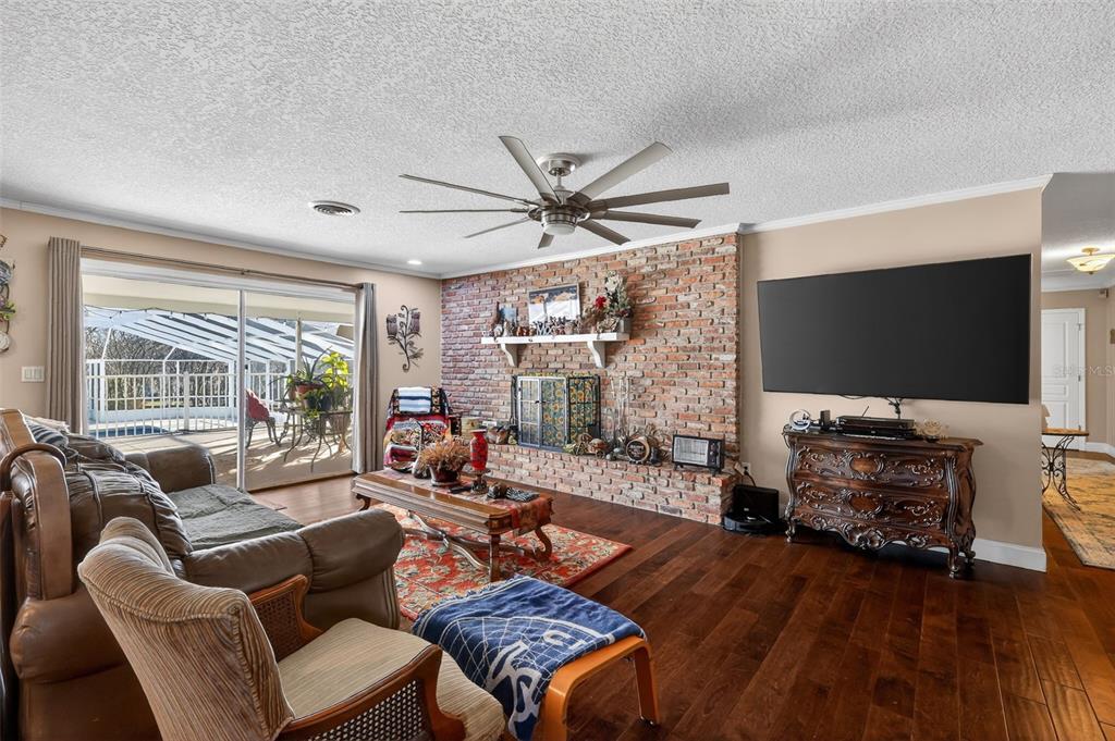 2230 Southwest 87th Place Ocala, FL 34476 - Photo 17 of 42 a living room with furniture and a flat screen tv