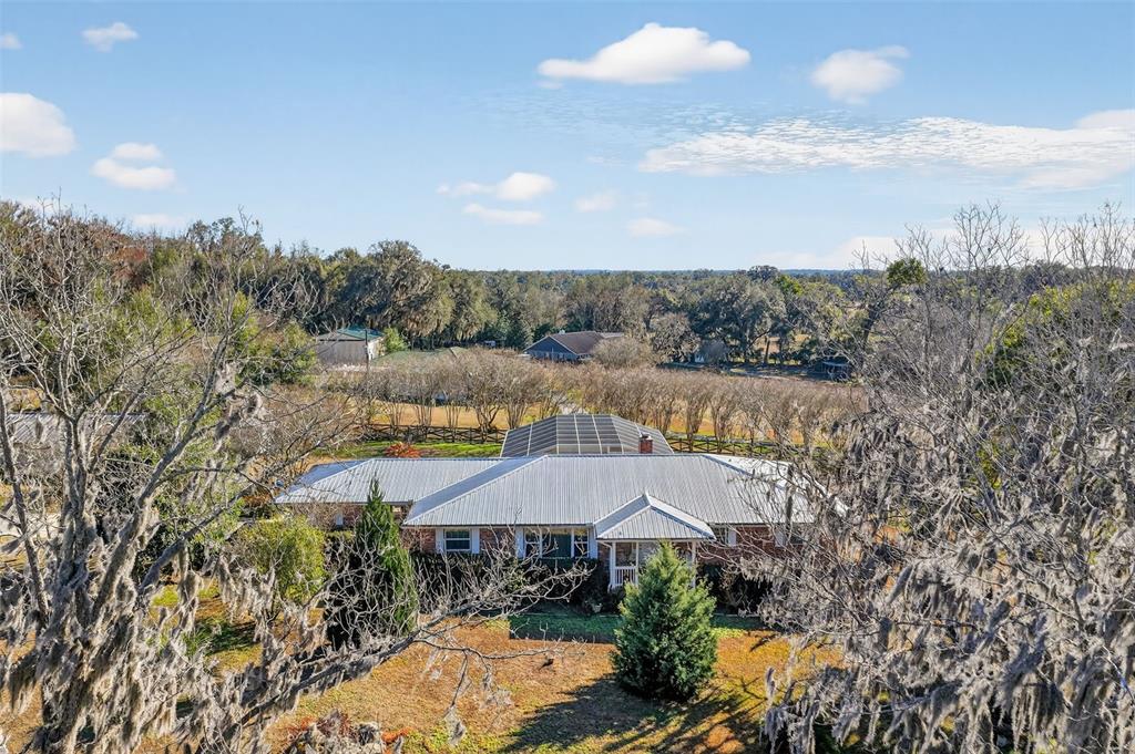2230 Southwest 87th Place Ocala, FL 34476 - Photo 2 of 42 a view of a house with a yard and mountains