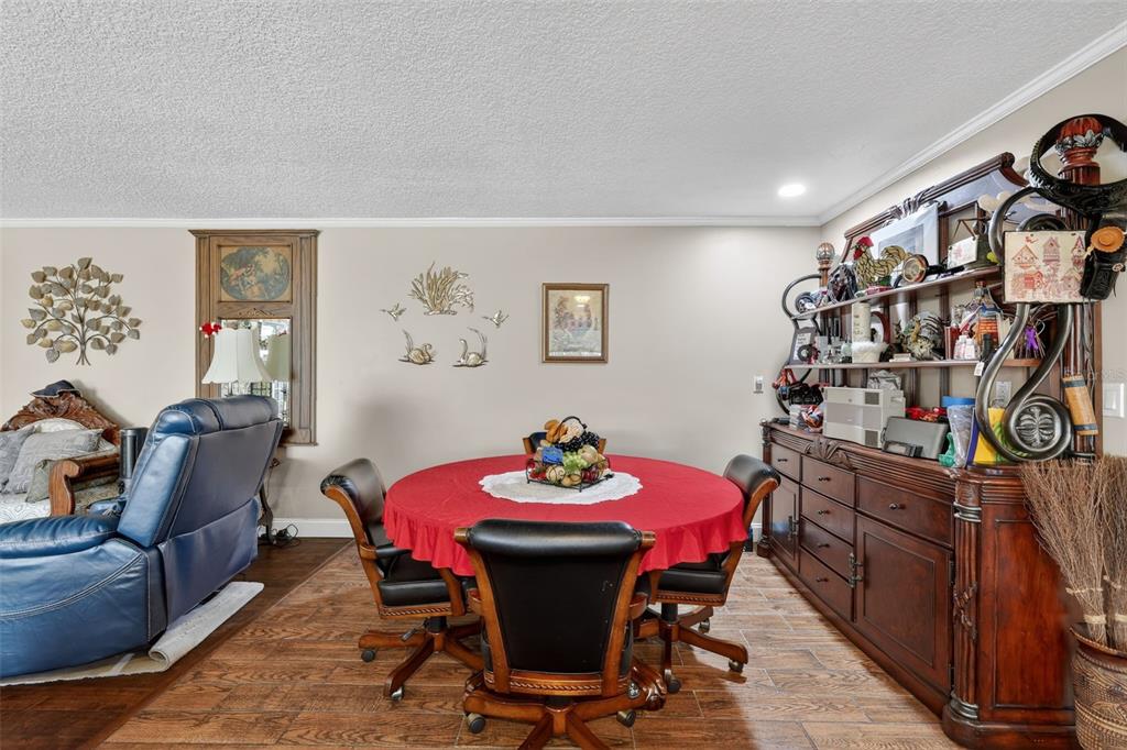 2230 Southwest 87th Place Ocala, FL 34476 - Photo 22 of 42 a view of a dining room with furniture and toys