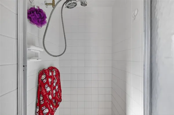 a bathroom with a toilet a sink and a mirror