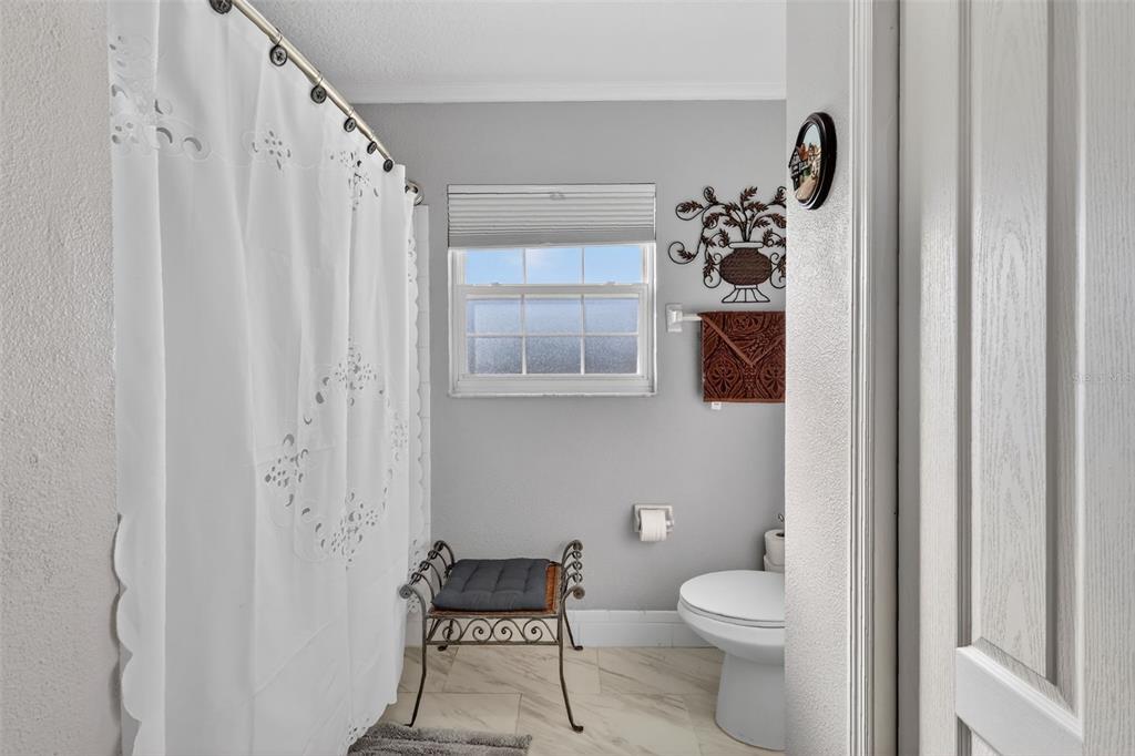 2230 Southwest 87th Place Ocala, FL 34476 - Photo 31 of 42 a bathroom with a toilet a sink and a mirror