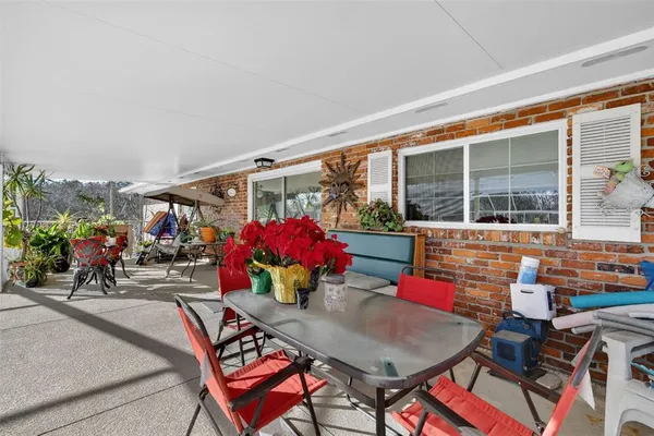 a view of a swimming pool with a patio