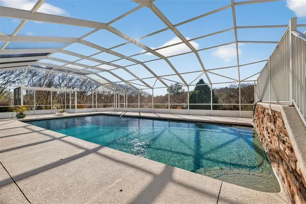 a view of a swimming pool with a patio