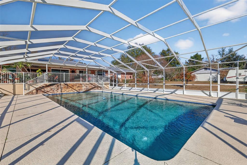 2230 Southwest 87th Place Ocala, FL 34476 - Photo 36 of 42 a view of a swimming pool with a patio