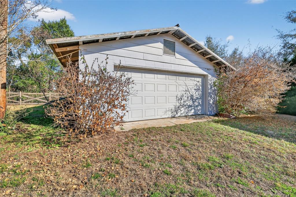 2230 Southwest 87th Place Ocala, FL 34476 - Photo 39 of 42 front view of a house with a yard