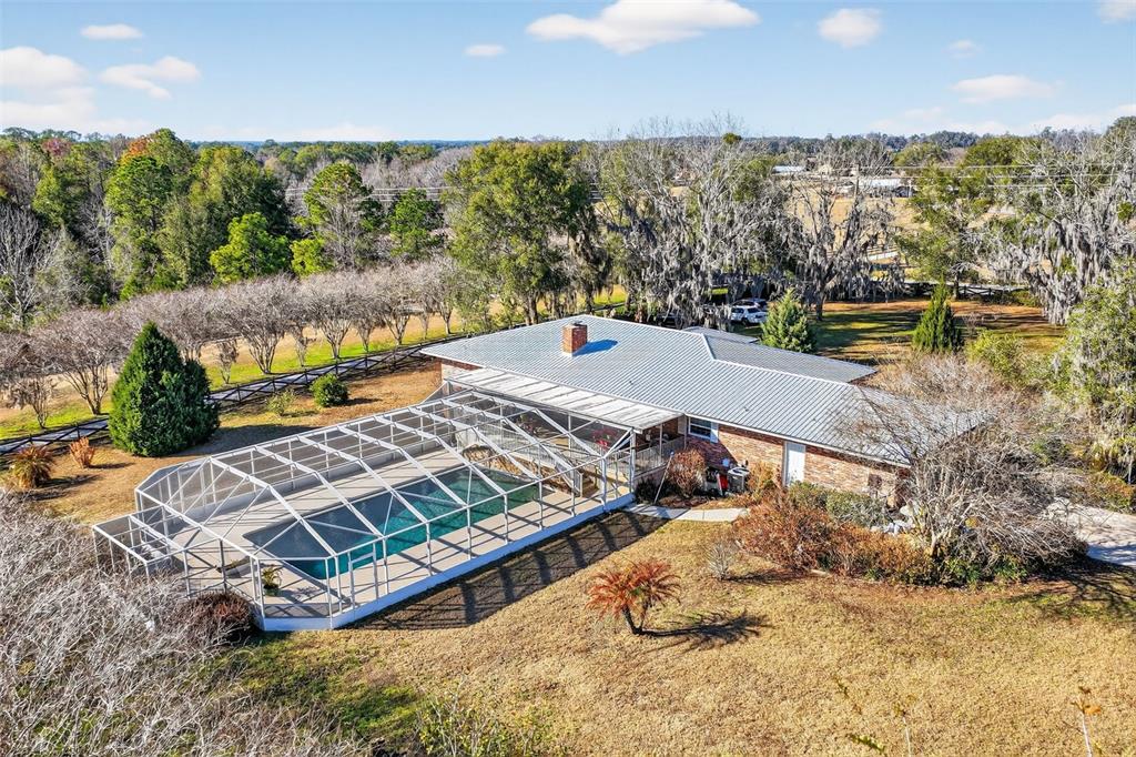 2230 Southwest 87th Place Ocala, FL 34476 - Photo 7 of 42 an aerial view of a house with a ocean view