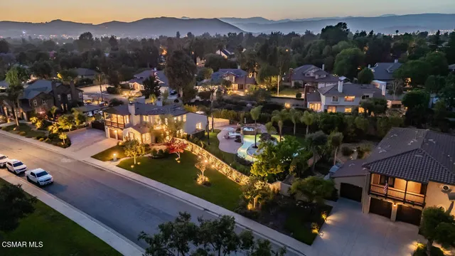 an aerial view of residential houses and outdoor space