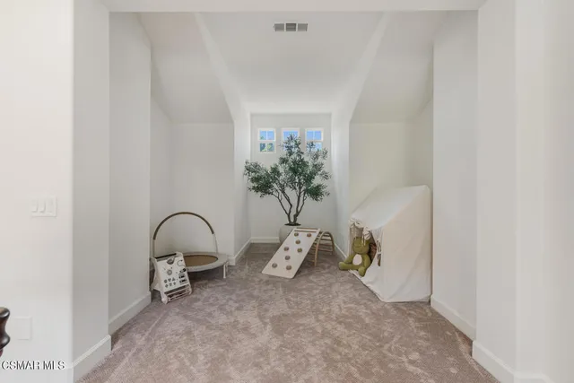 a view of a swimming pool with lounge chairs