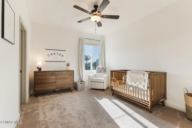 a front view of a house with a garden and patio