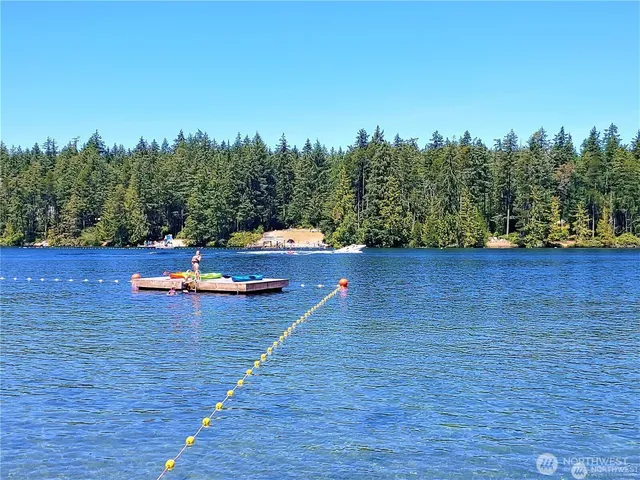 a view of lake with a house in the background