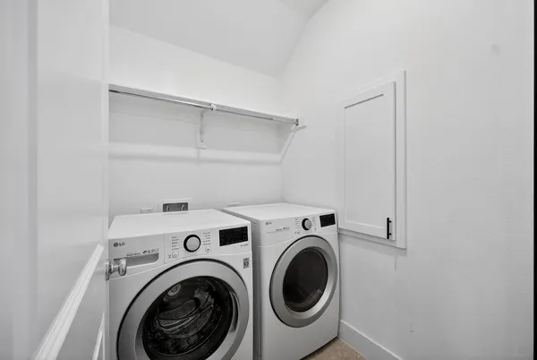a utility room with dryer and washer