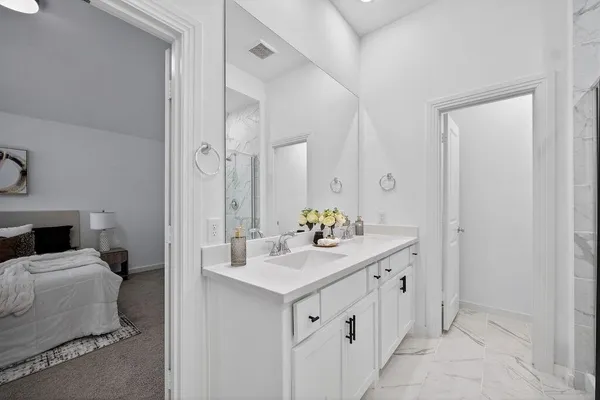 a bathroom with a sink double vanity and a mirror