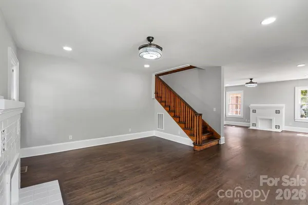 a view of an entryway with wooden floor