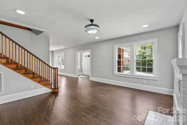 a view of an entryway with wooden floor