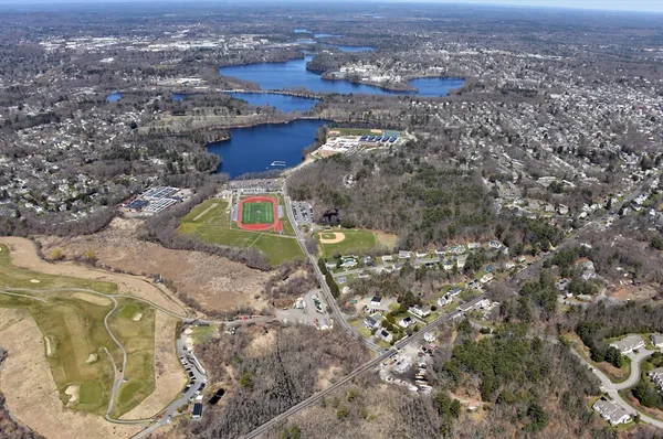 an aerial view of residential house and outdoor space