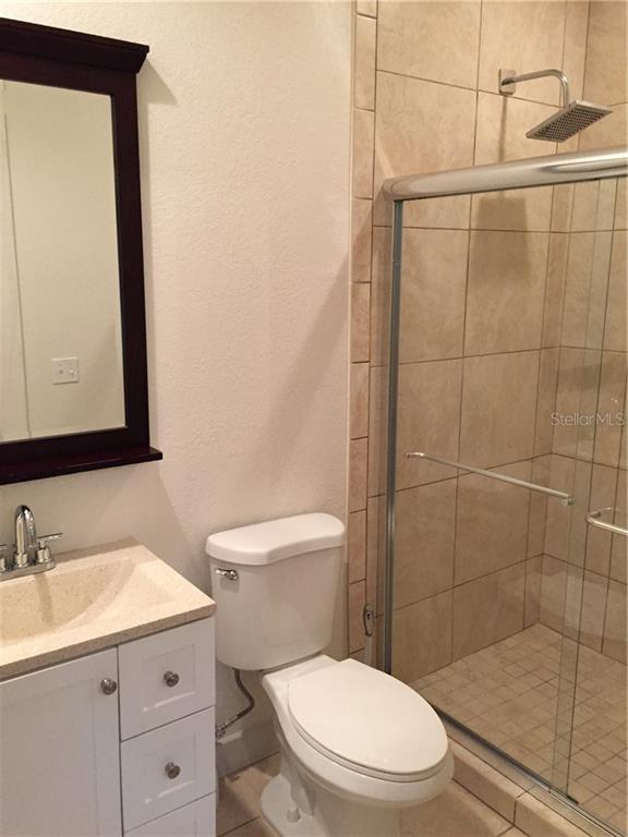 Undisclosed Address Bradenton, FL 34208 - Photo 10 of 13 a bathroom with a sink a toilet and shower