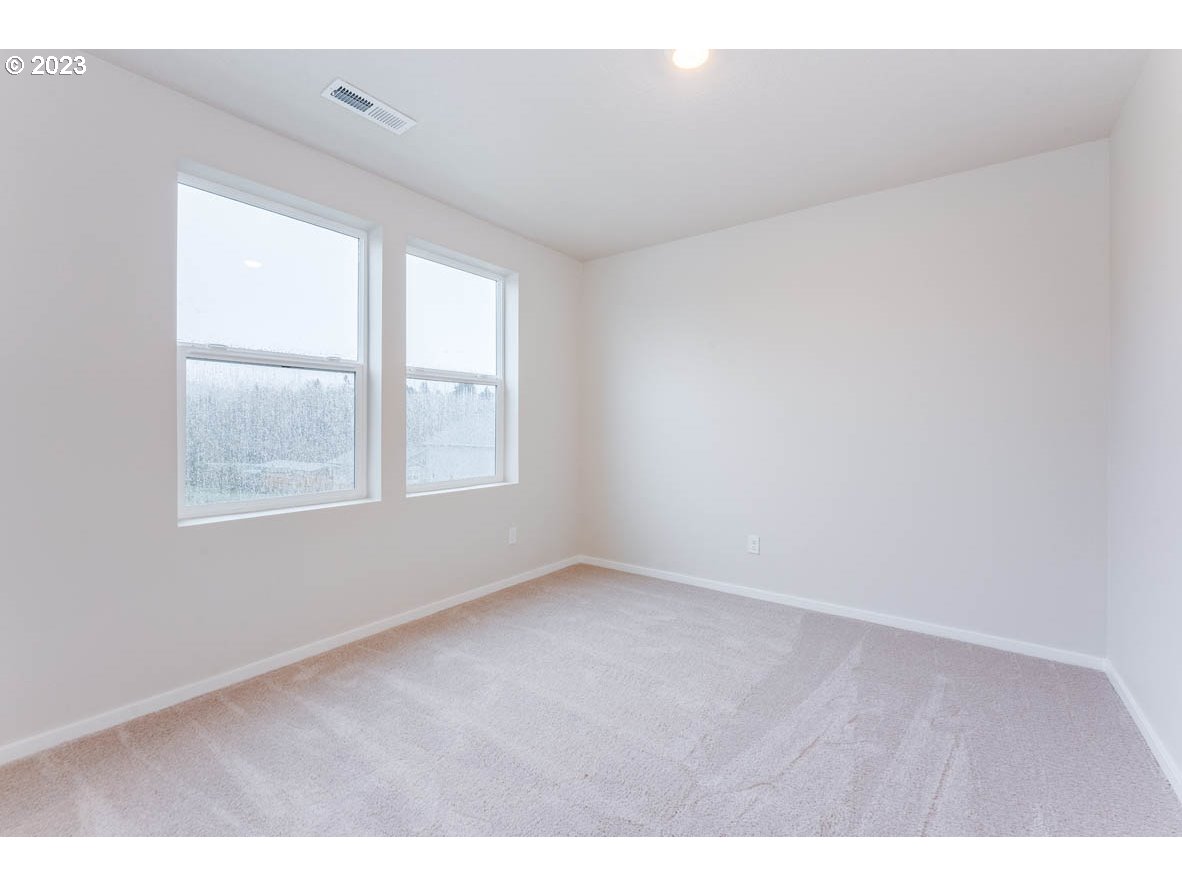 3217 Southeast 35th Street Gresham, OR 97080 - Photo 17 of 30 a view of an empty room with a window