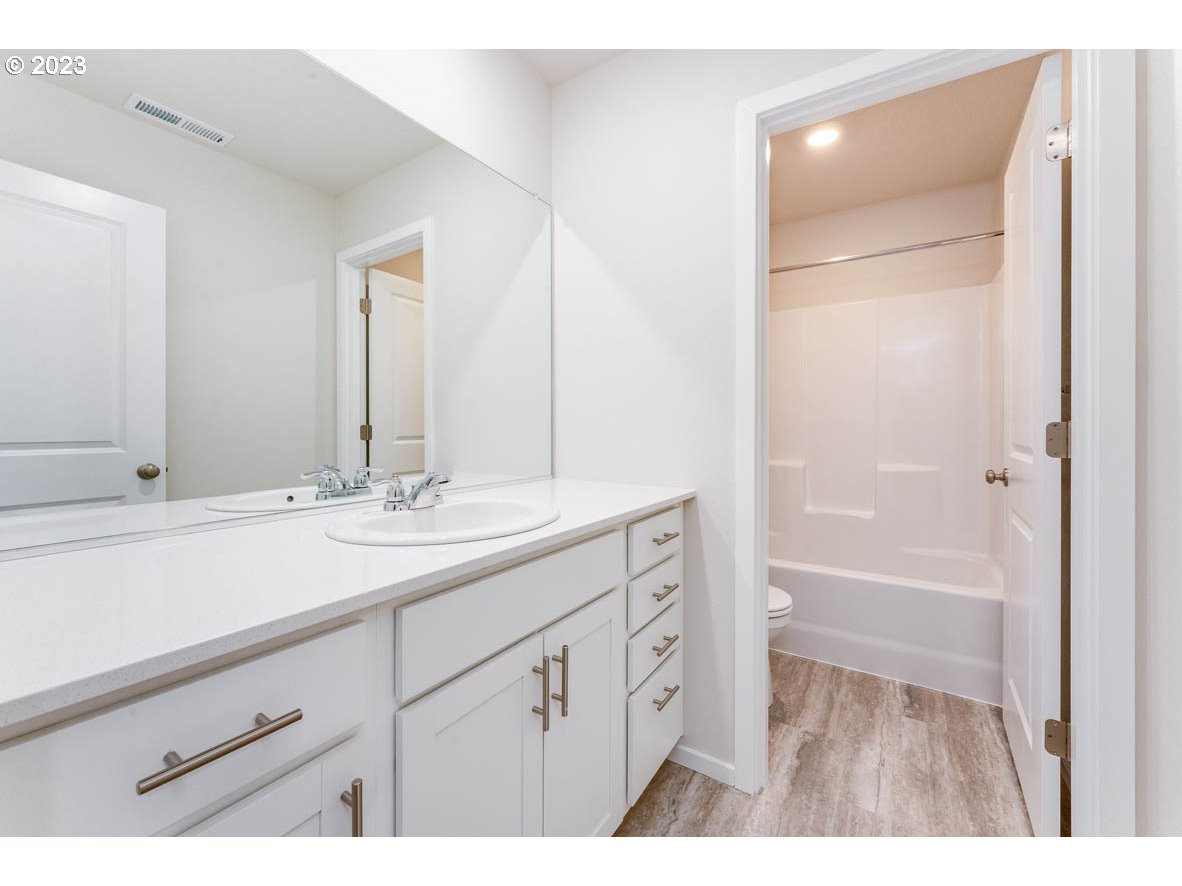 3217 Southeast 35th Street Gresham, OR 97080 - Photo 21 of 30 a bathroom with a sink and a mirror