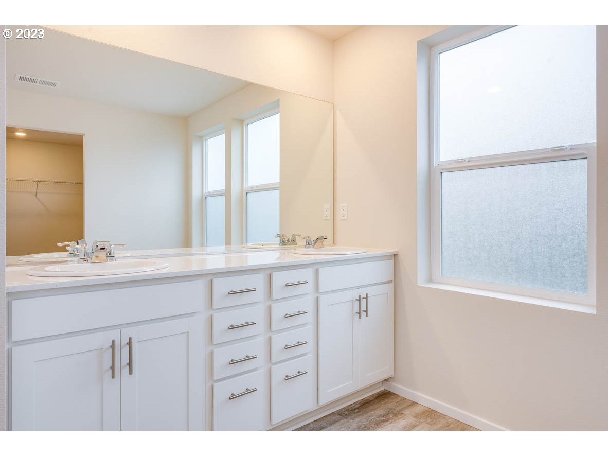 3217 Southeast 35th Street Gresham, OR 97080 - Photo 24 of 30 a bathroom with a sink and a mirror