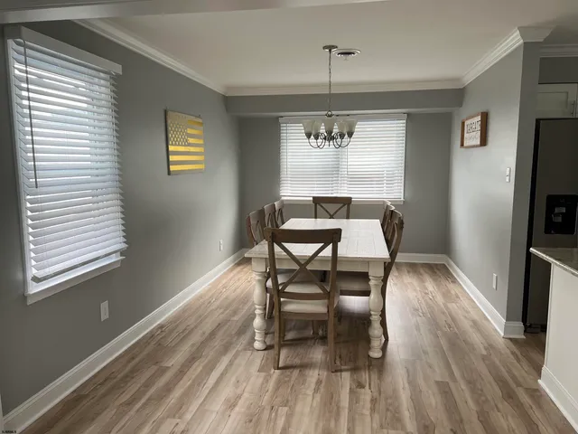 a workspace room with wooden floor windows and wooden floor