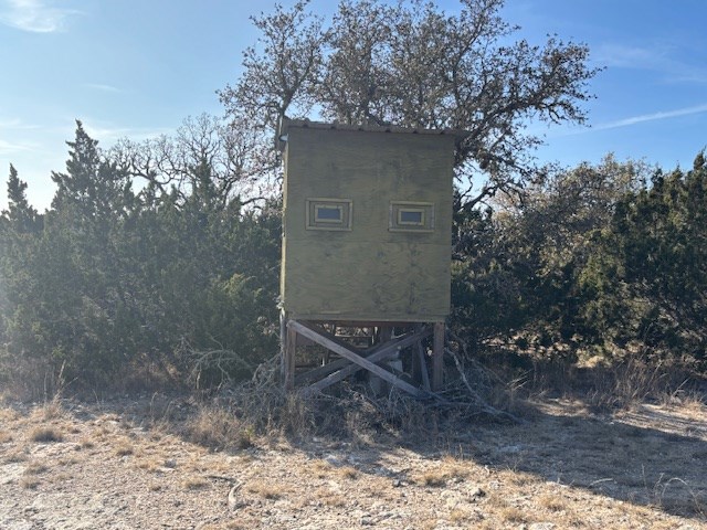 11943 Cr 310 Rocksprings Tx 78880 Rocksprings, TX 78880 - Photo 43 of 61 a view of a wooden house with a yard